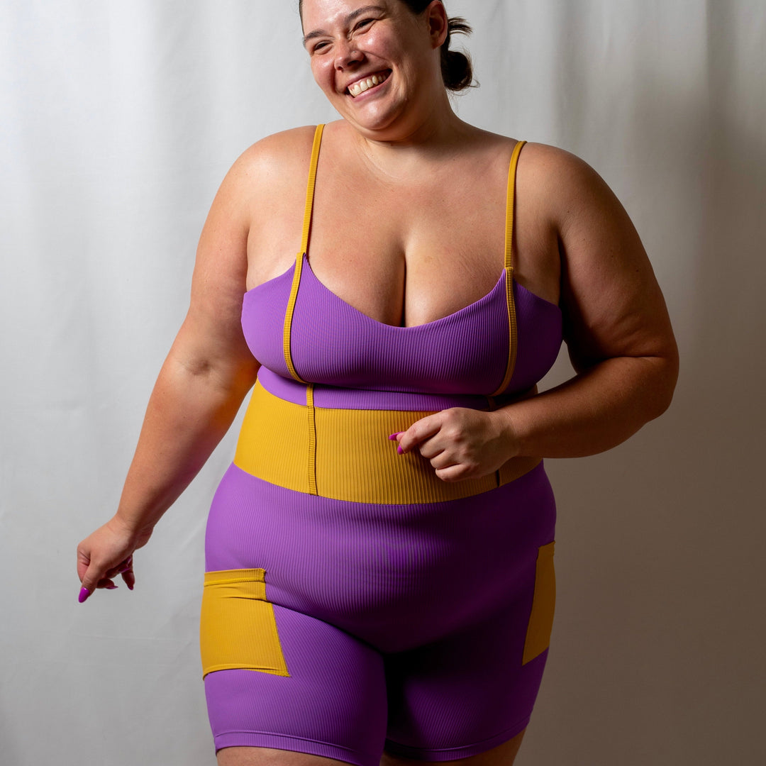 women's purple yellow activewear bodysuit with pockets