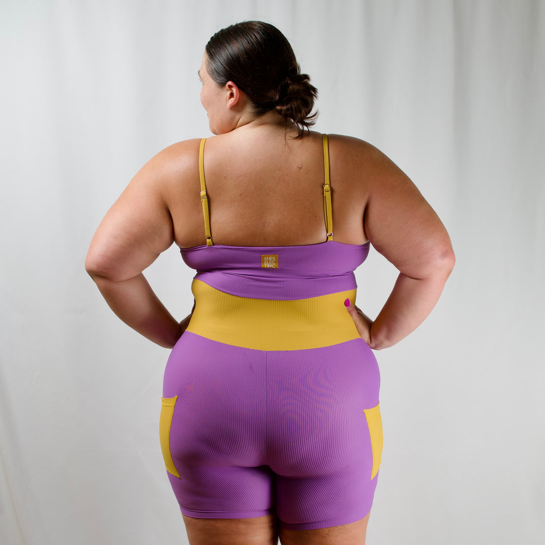 women's purple yellow activewear bodysuit with pockets