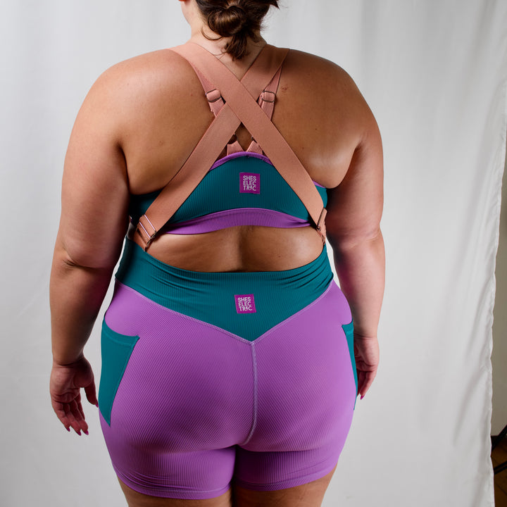 women's activewear purple teal bike shorts with pink suspender straps